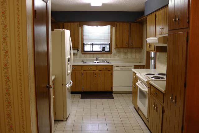 3845 Poverty Creek Road Crestview, FL 32539 - Photo 3 of 32 a kitchen with a sink stove and refrigerator