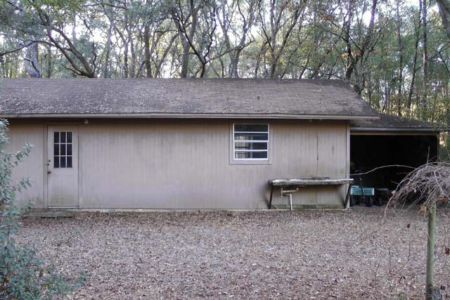3845 Poverty Creek Road Crestview, FL 32539 - Photo 31 of 32 a backyard of a house with barbeque oven