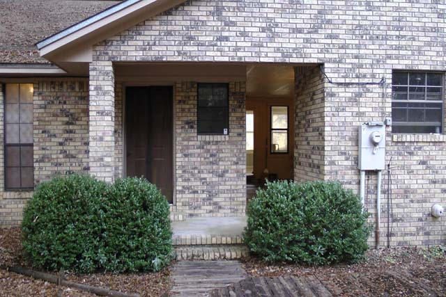 3845 Poverty Creek Road Crestview, FL 32539 - Photo 5 of 32 a front view of a house with potted plants