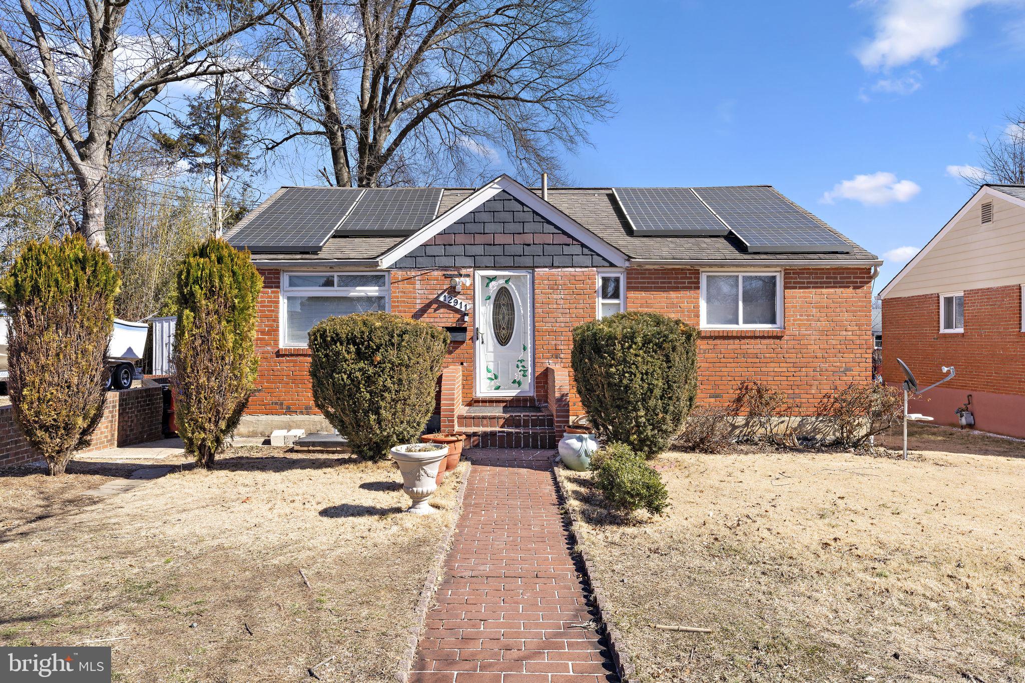 12911 Valleywood Drive Silver Spring, MD 20906 - Photo 1 of 43 a view of a house with snow on the side of the road