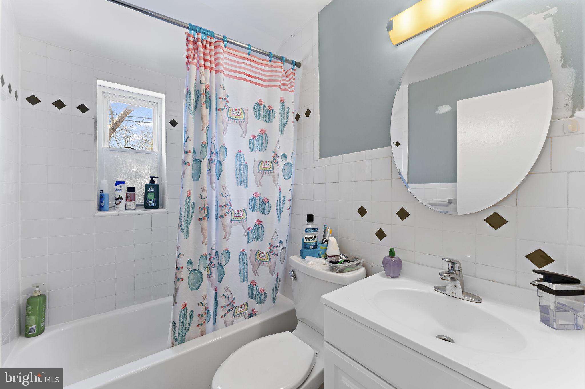 12911 Valleywood Drive Silver Spring, MD 20906 - Photo 17 of 43 a bathroom with a sink toilet and shower