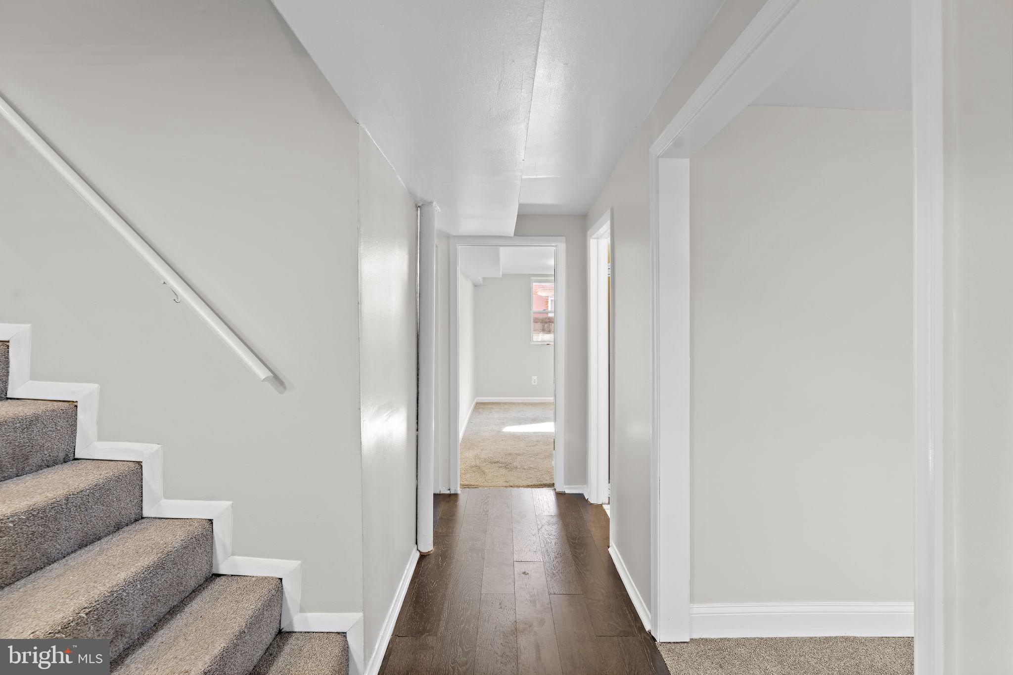 12911 Valleywood Drive Silver Spring, MD 20906 - Photo 22 of 43 a view of a hallway with furniture and wooden floor
