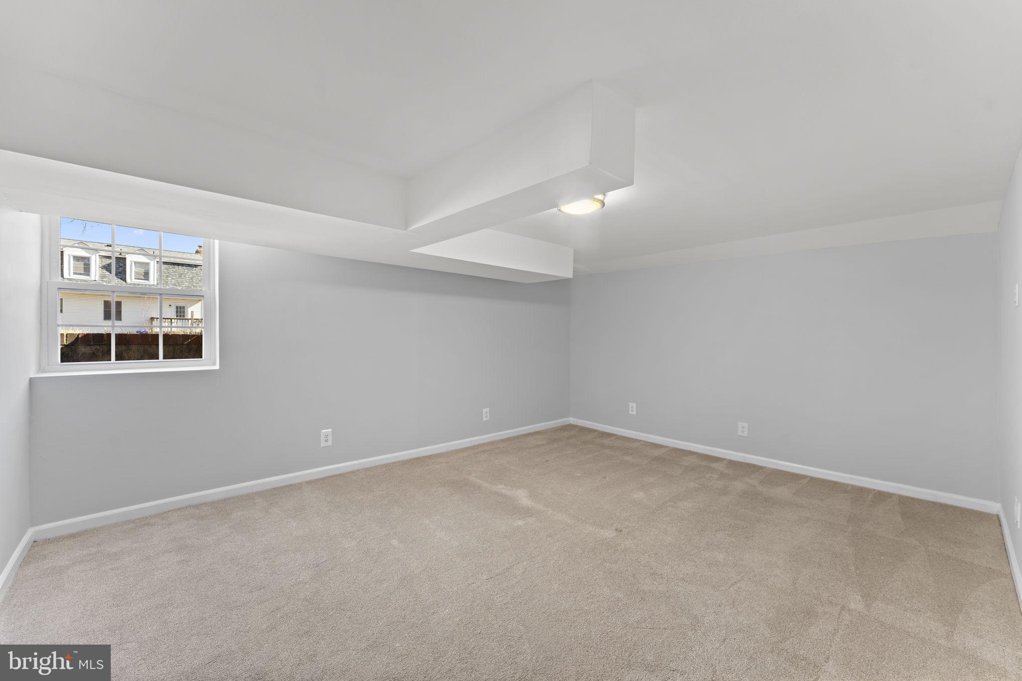 12911 Valleywood Drive Silver Spring, MD 20906 - Photo 23 of 43 a view of an empty room with a window