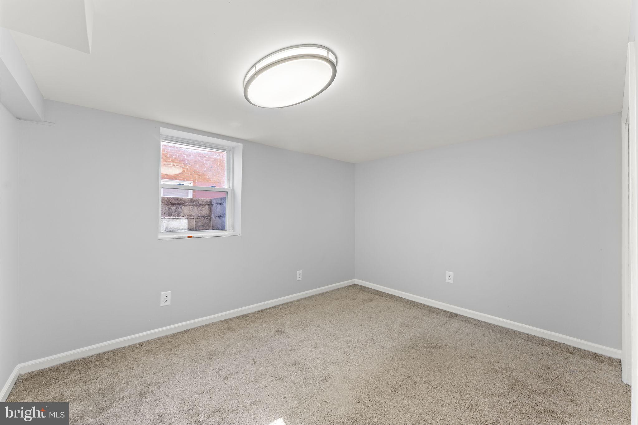 12911 Valleywood Drive Silver Spring, MD 20906 - Photo 27 of 43 an empty room with windows