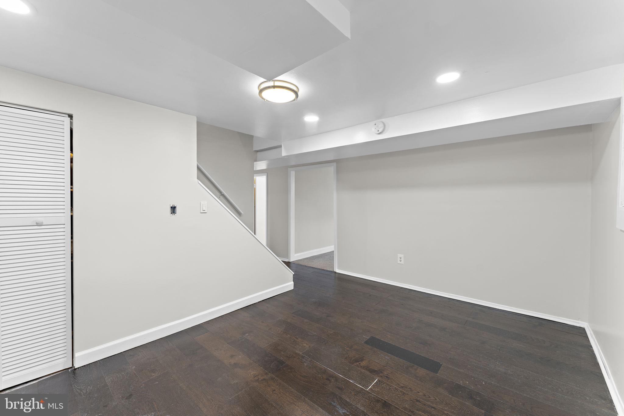 12911 Valleywood Drive Silver Spring, MD 20906 - Photo 28 of 43 an empty room with wooden floor