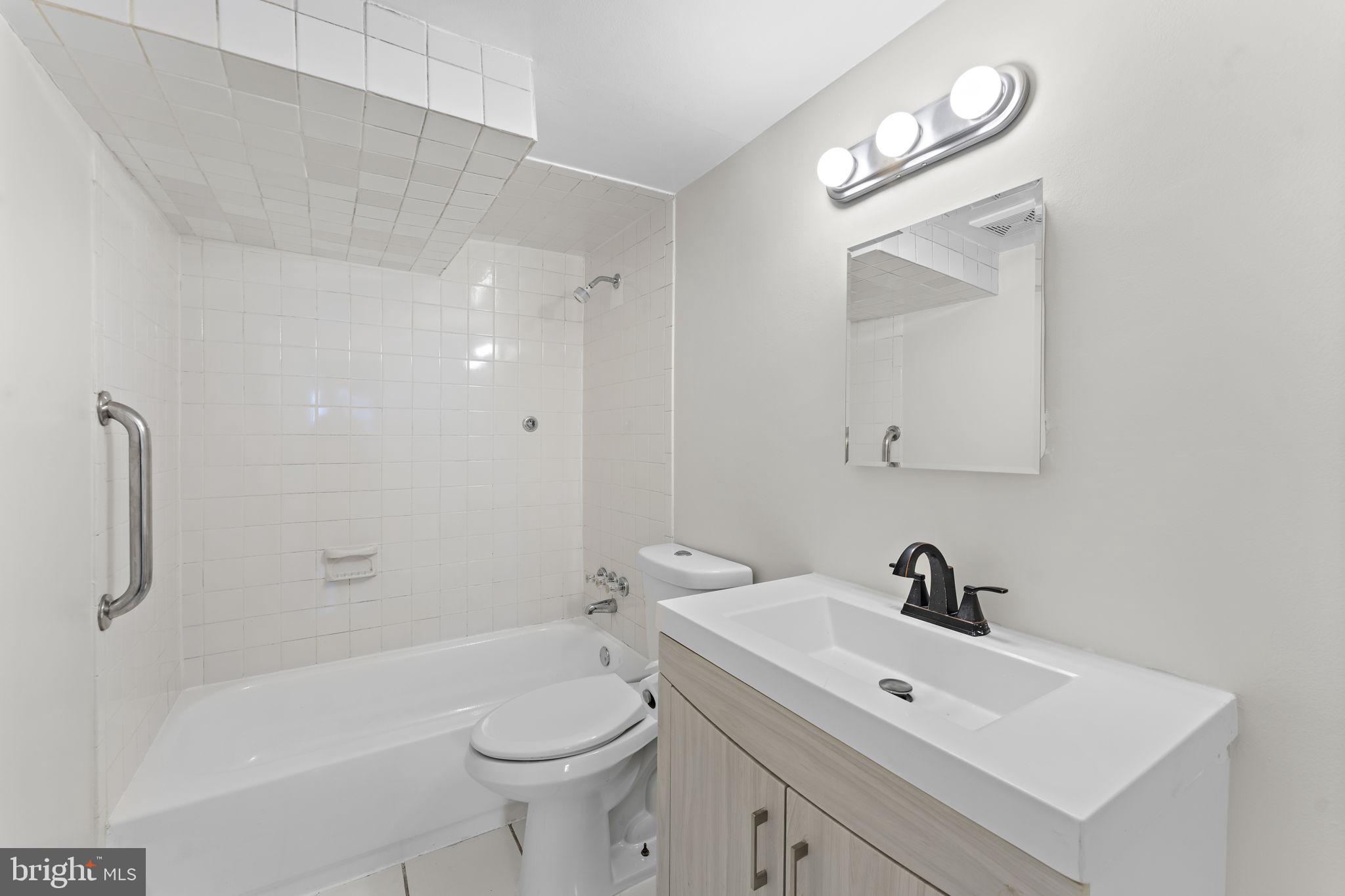 12911 Valleywood Drive Silver Spring, MD 20906 - Photo 29 of 43 a bathroom with a sink a toilet and shower