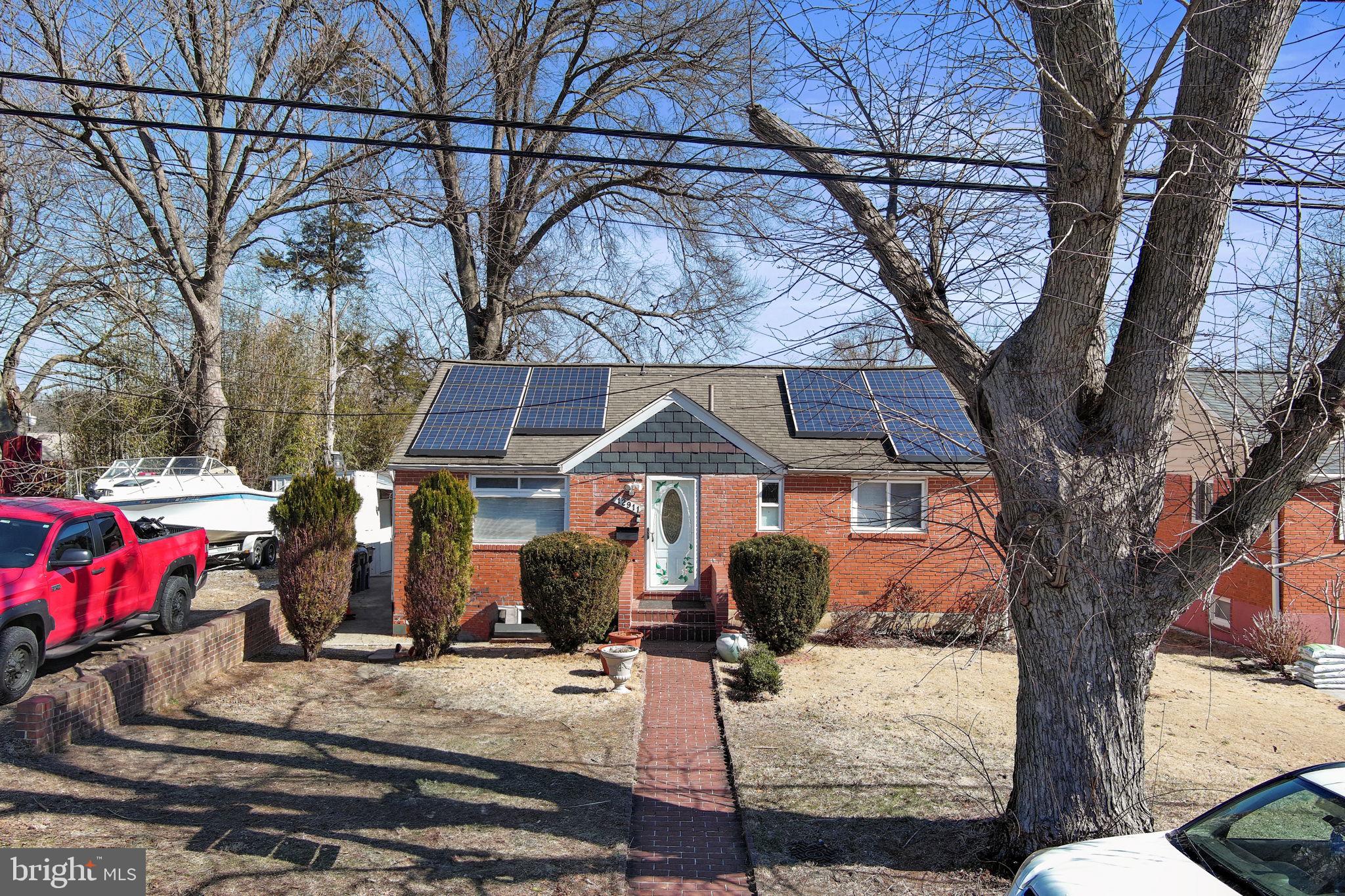 12911 Valleywood Drive Silver Spring, MD 20906 - Photo 40 of 43 a front view of a house with large trees