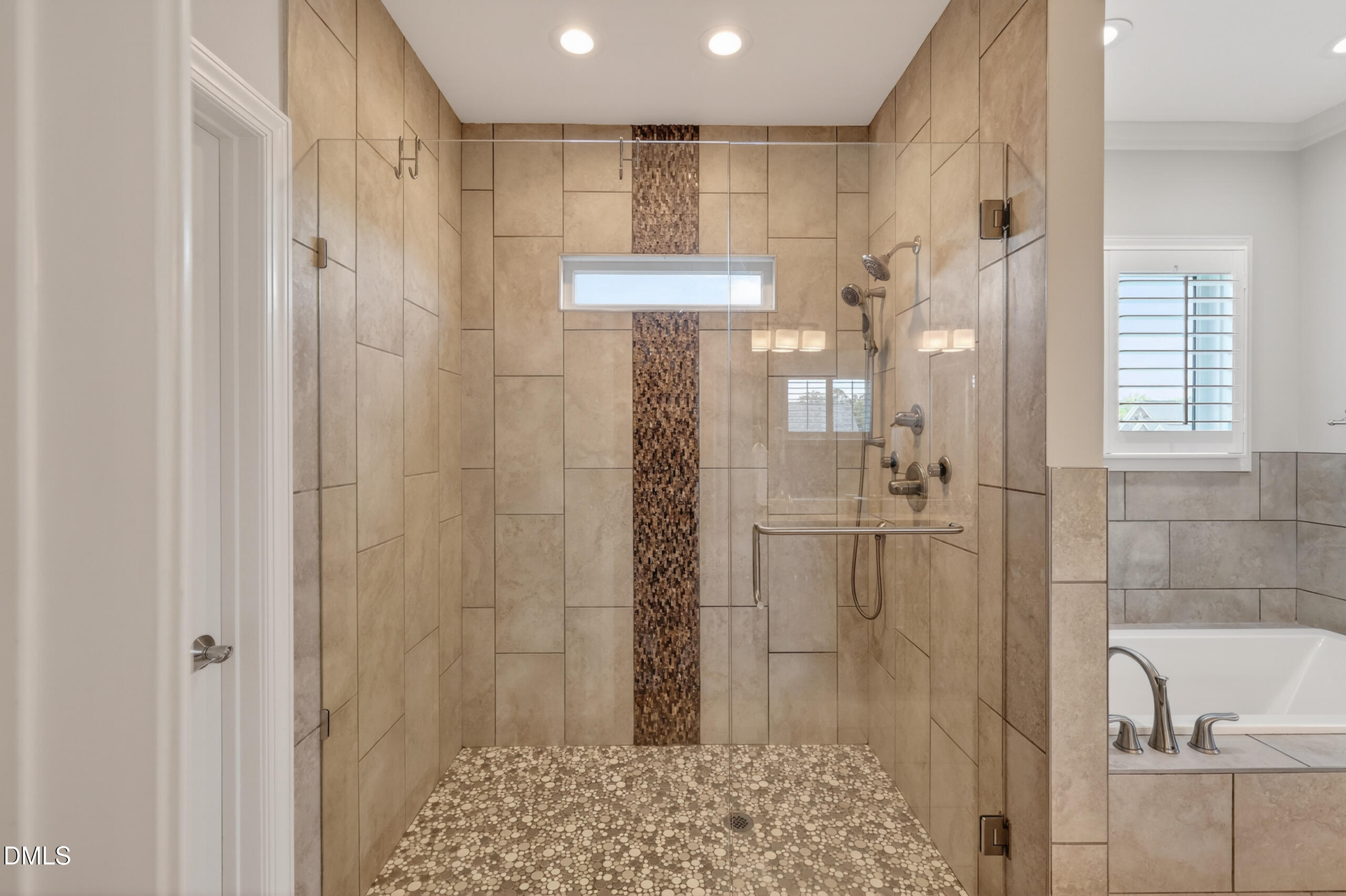 261 Character Drive Rolesville, NC 27571 - Photo 39 of 77 a bathroom with a shower and a sink