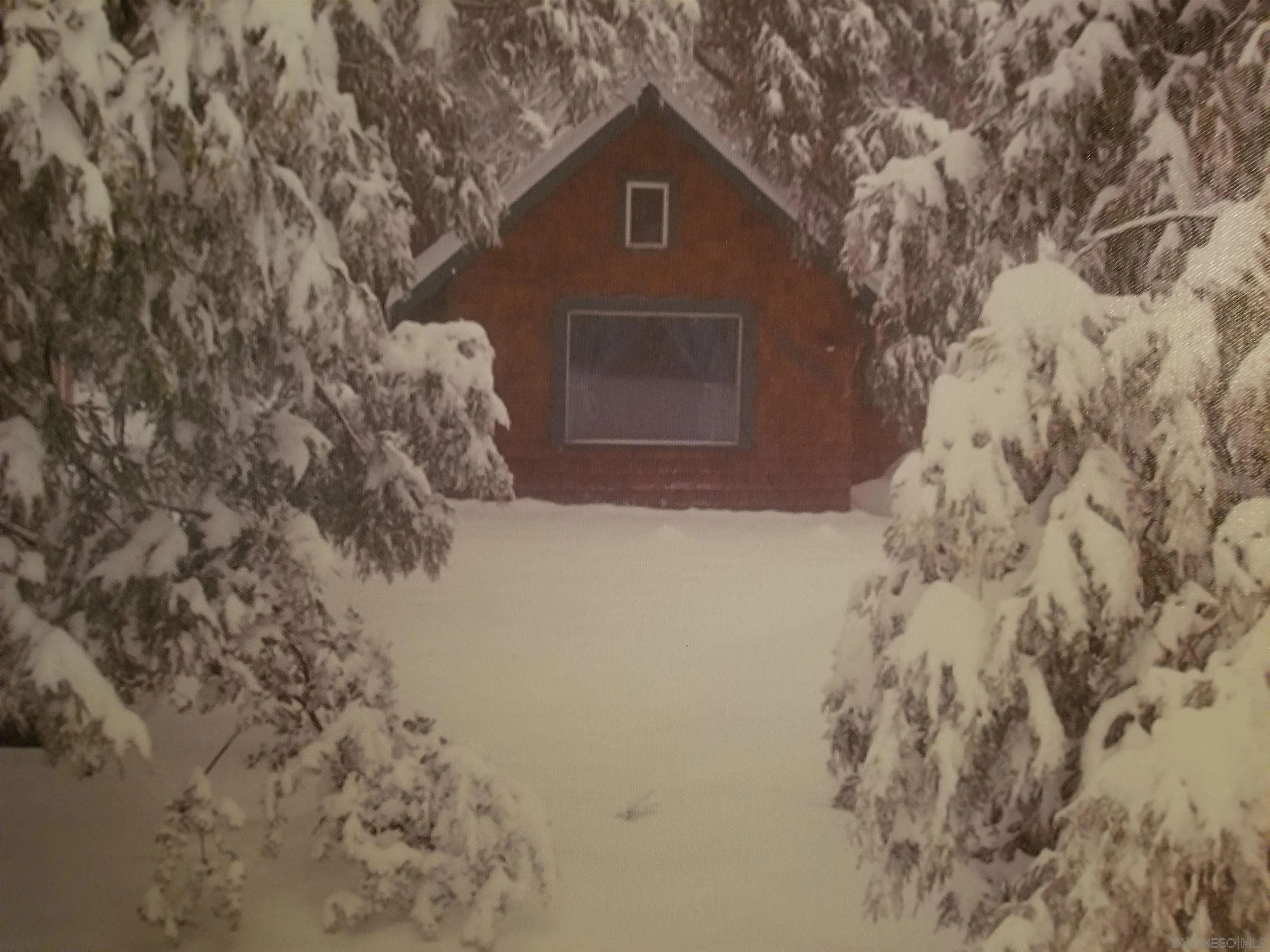 53540 Middleridge Drive Idyllwild, CA 92549 - Photo 2 of 18 a front view of a house with a yard covered with snow