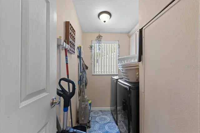 a spacious bedroom with a bed couch and window