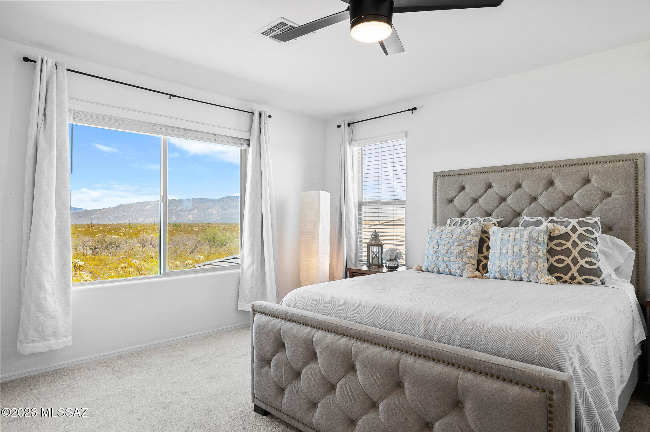 12092 East Ryscott Circle Vail, AZ 85641 - Photo 32 of 49 a bedroom with a large bed and a window
