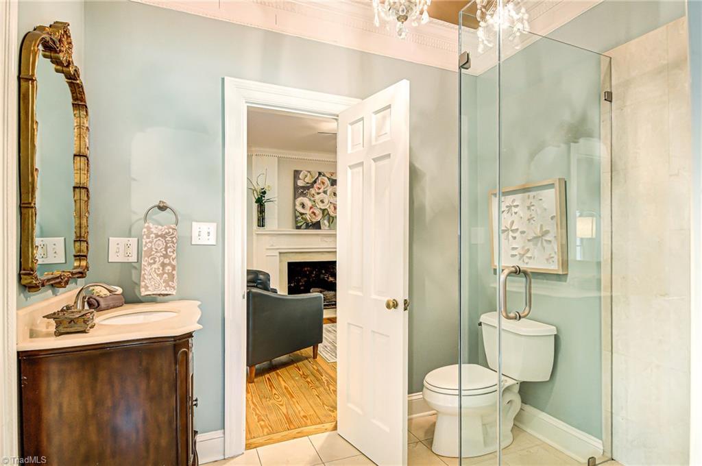 5703 Anson Road Greensboro, NC 27407 - Photo 22 of 30 Second full bath on the main floor leads to keeping room and connects to bedroom/office.