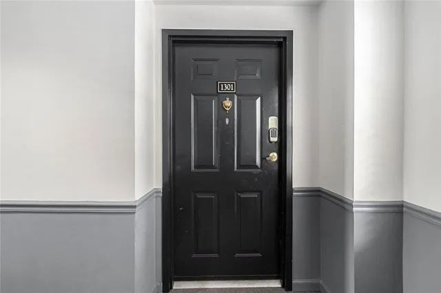 a view of an empty room with a window