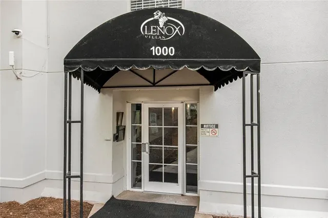 a sign that is in front of flowers