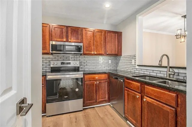 a kitchen with a refrigerator and window