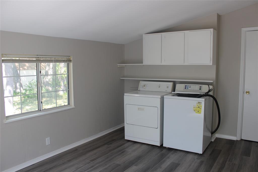 409 West Main Street Azle, TX 76020 - Photo 10 of 12 a utility room with wooden floor washer and dryer