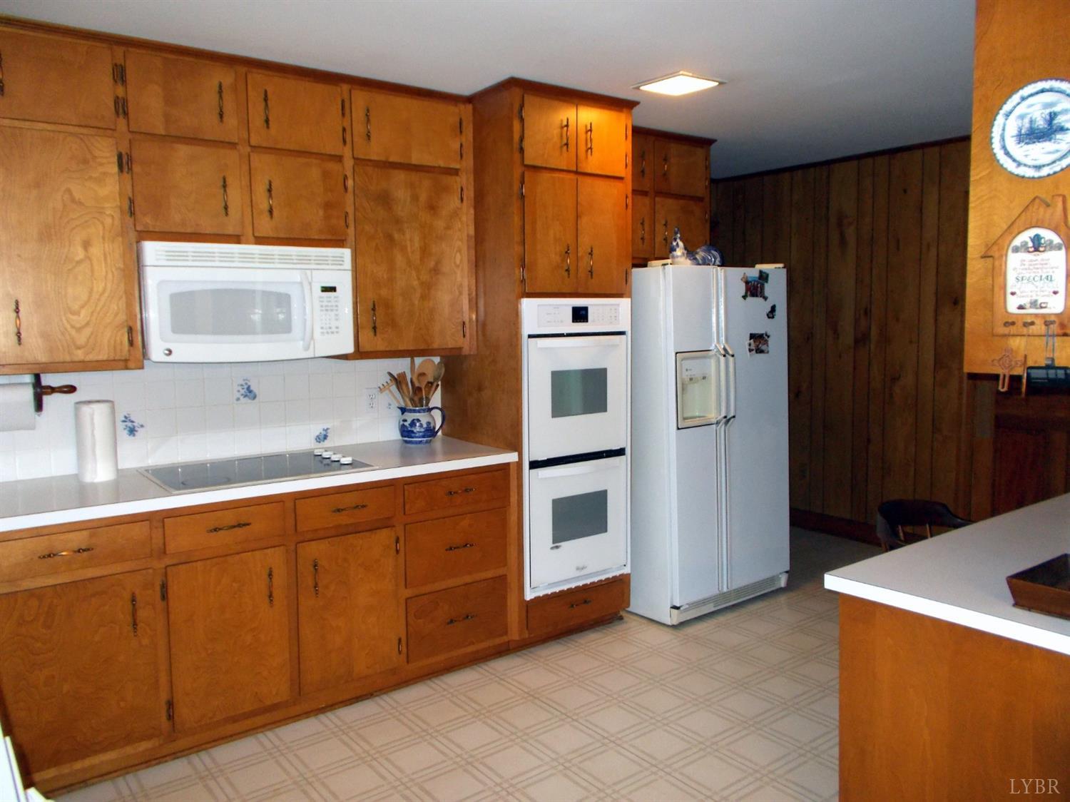 110 River Road Altavista, VA 24517 - Photo 12 of 51 a kitchen with refrigerator and cabinets