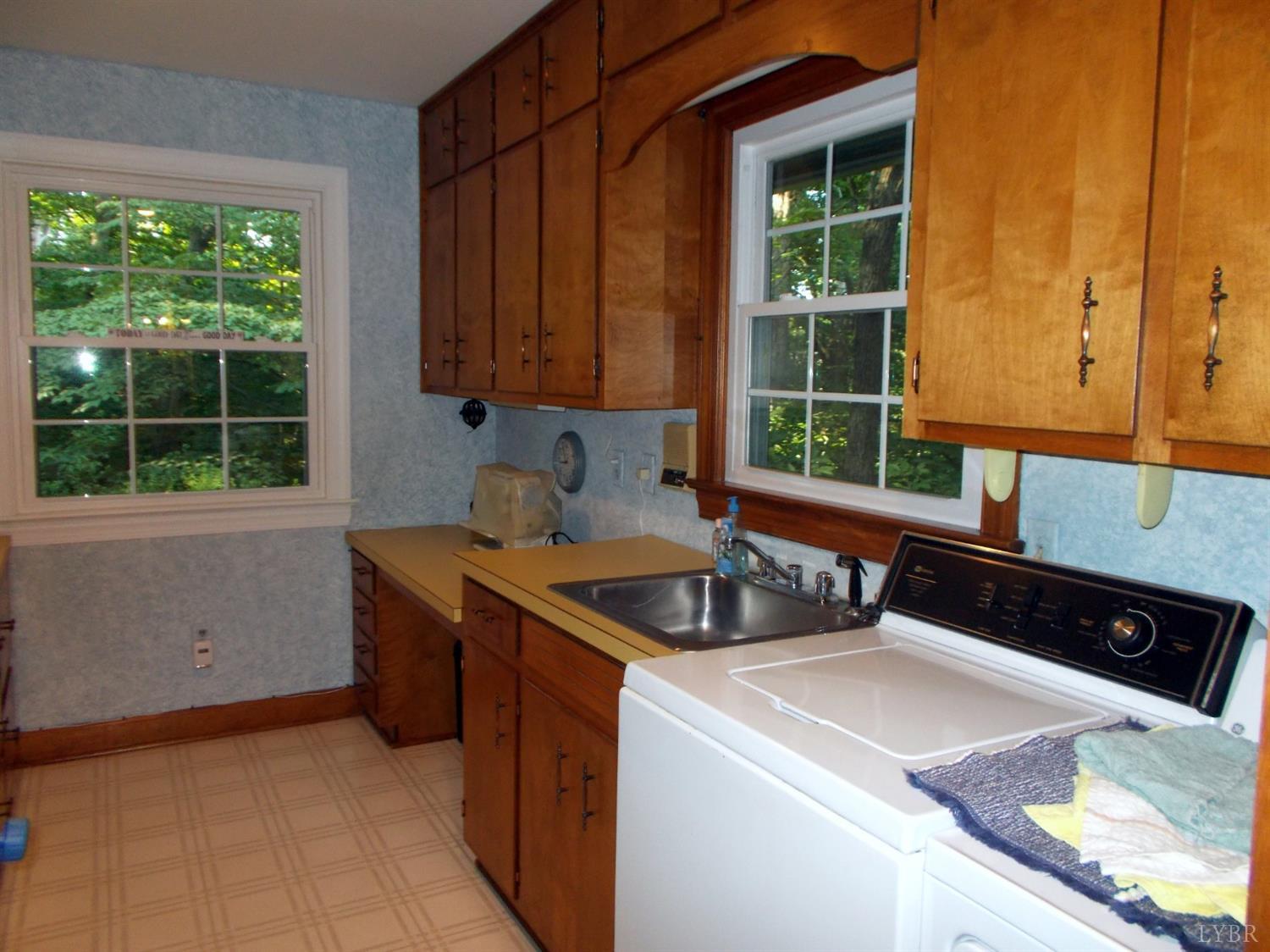 110 River Road Altavista, VA 24517 - Photo 16 of 51 a kitchen that has a sink and a stove in it