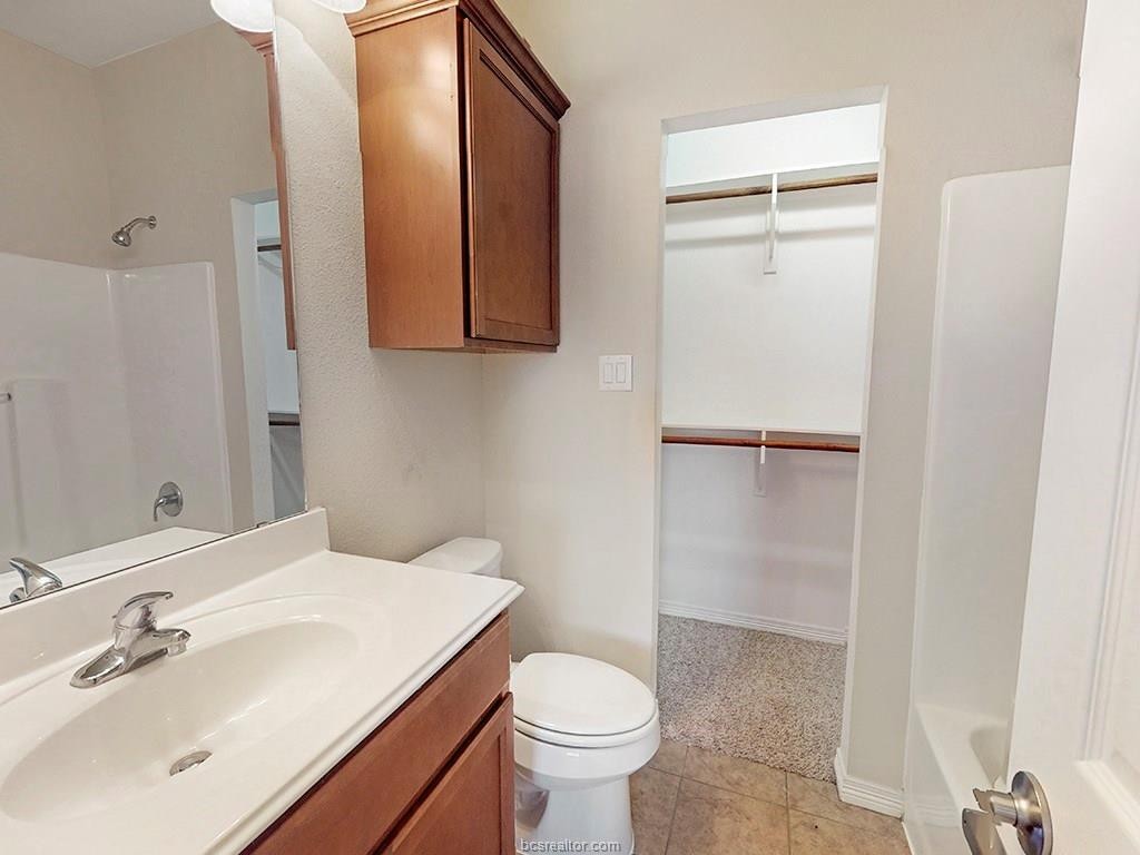 1198 Jones-Butler Road, Unit 2607 College Station, TX 77840 - Photo 21 of 26 a bathroom with a sink a toilet and shower
