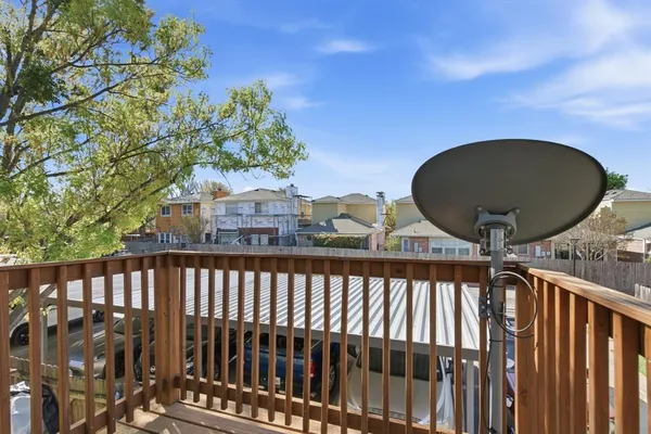 a front view of a house with a garden and plants