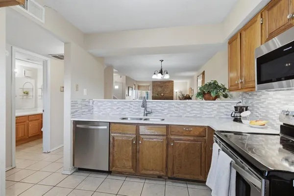 a kitchen with a sink and cabinets
