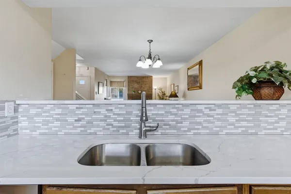 a sink with a granite counter top