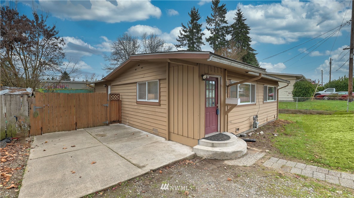 2519 Northeast 9th Street Renton, WA 98056 - Photo 2 of 26 a front view of a house with a yard