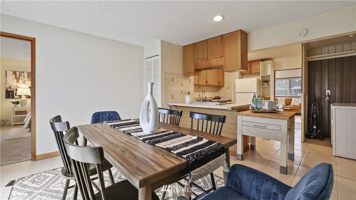 2519 Northeast 9th Street Renton, WA 98056 - Photo 16 of 26 a dining room with furniture and wooden floor