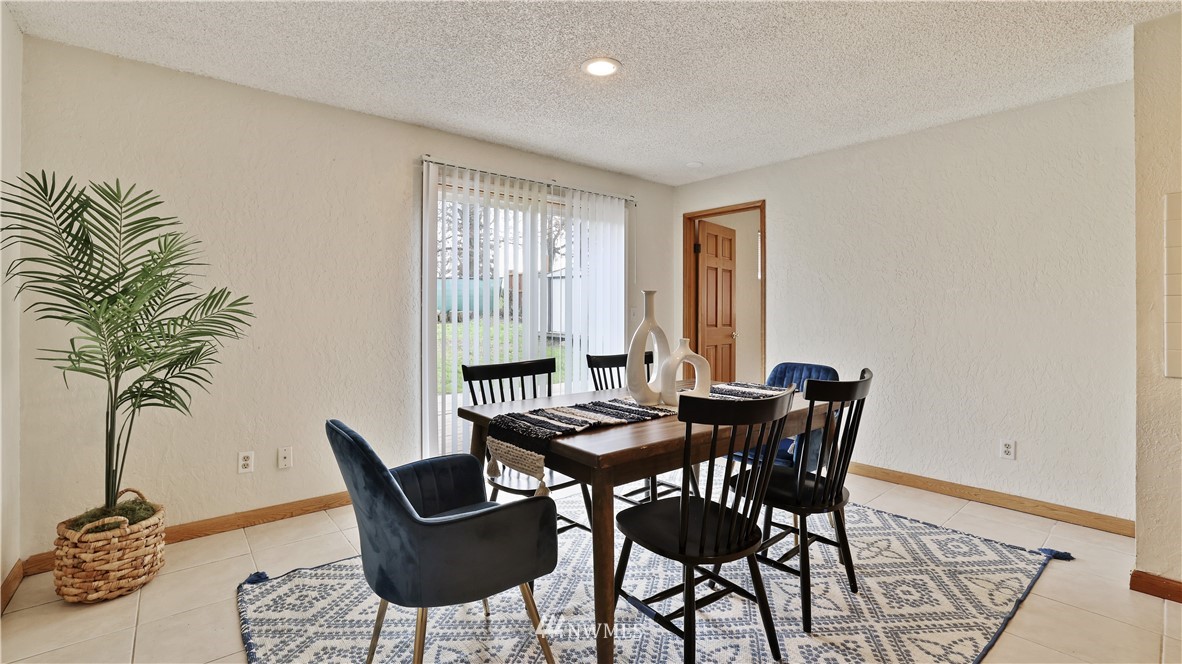 2519 Northeast 9th Street Renton, WA 98056 - Photo 17 of 26 a view of a dining room with furniture and window