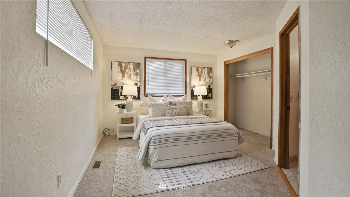 2519 Northeast 9th Street Renton, WA 98056 - Photo 18 of 26 a bedroom with a bed and window