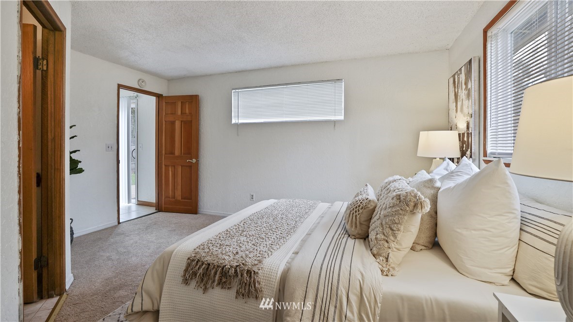 2519 Northeast 9th Street Renton, WA 98056 - Photo 19 of 26 a bedroom with a bed and a window
