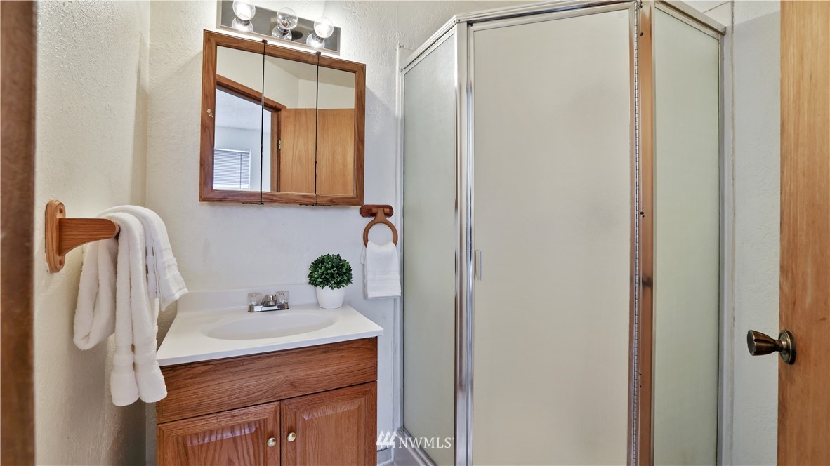 2519 Northeast 9th Street Renton, WA 98056 - Photo 20 of 26 a bathroom with a sink and a mirror