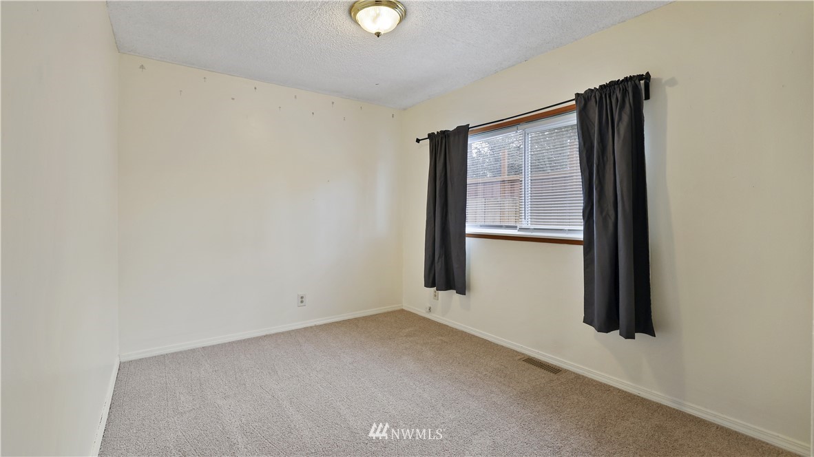 2519 Northeast 9th Street Renton, WA 98056 - Photo 22 of 26 an empty room with windows