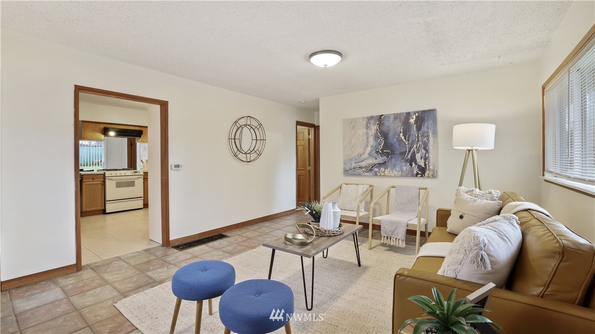 2519 Northeast 9th Street Renton, WA 98056 - Photo 5 of 26 a living room with furniture and a table
