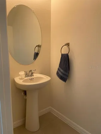 a bathroom with a sink and mirror