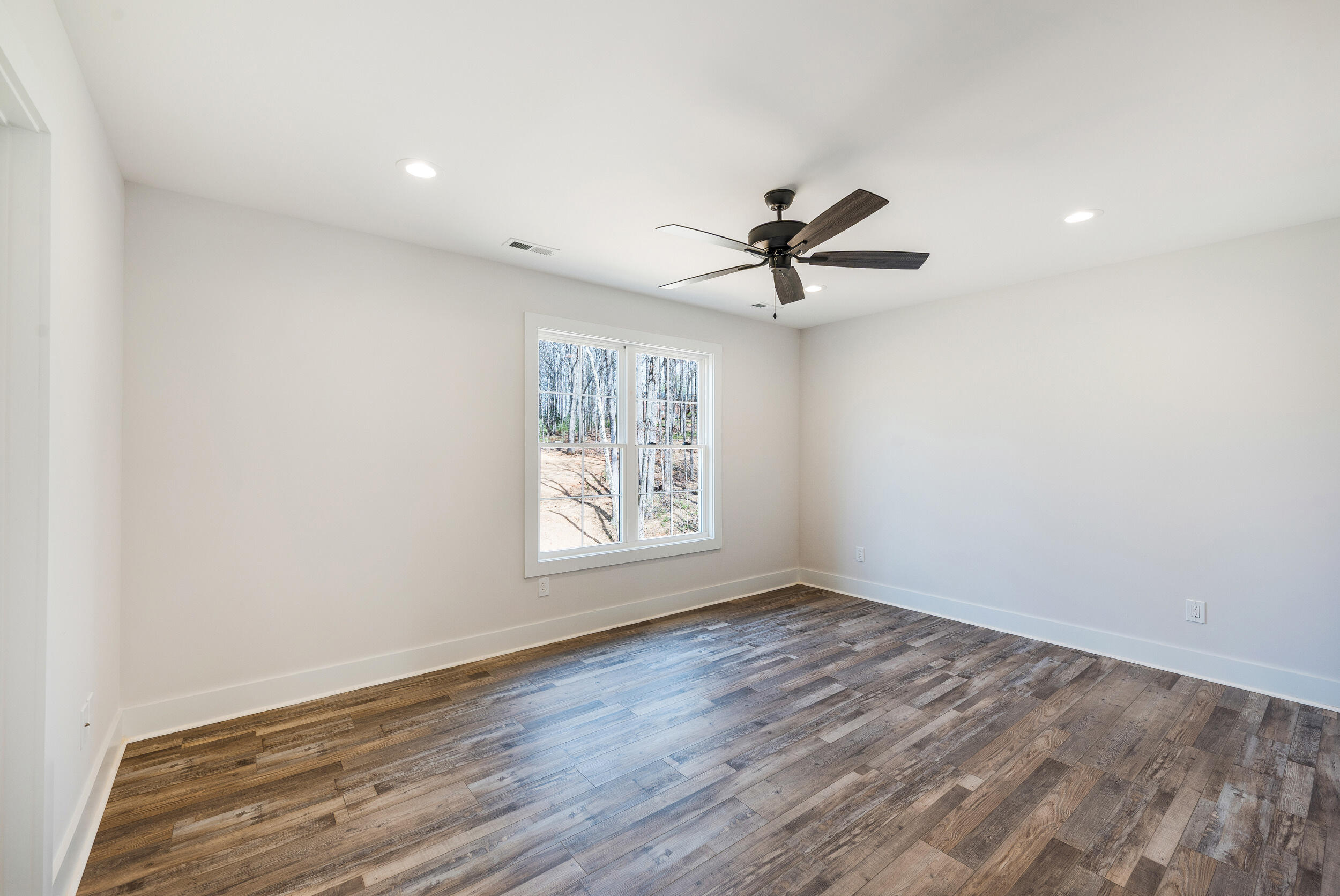 2199 Cottontown Road Forest, VA 24551 - Photo 18 of 35 an empty room with wooden floor and windows