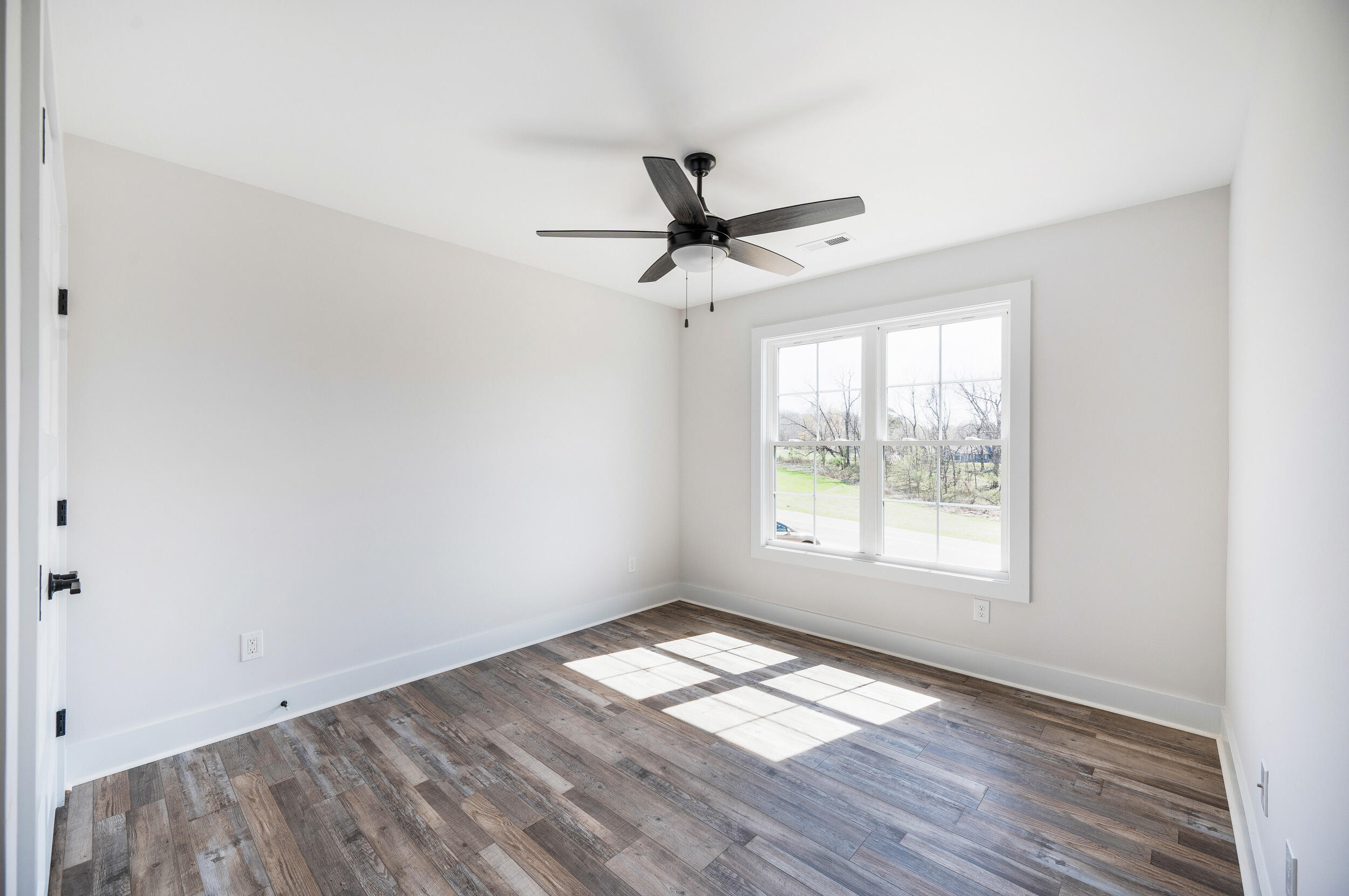 2199 Cottontown Road Forest, VA 24551 - Photo 21 of 35 a view of empty room with wooden floor and fan