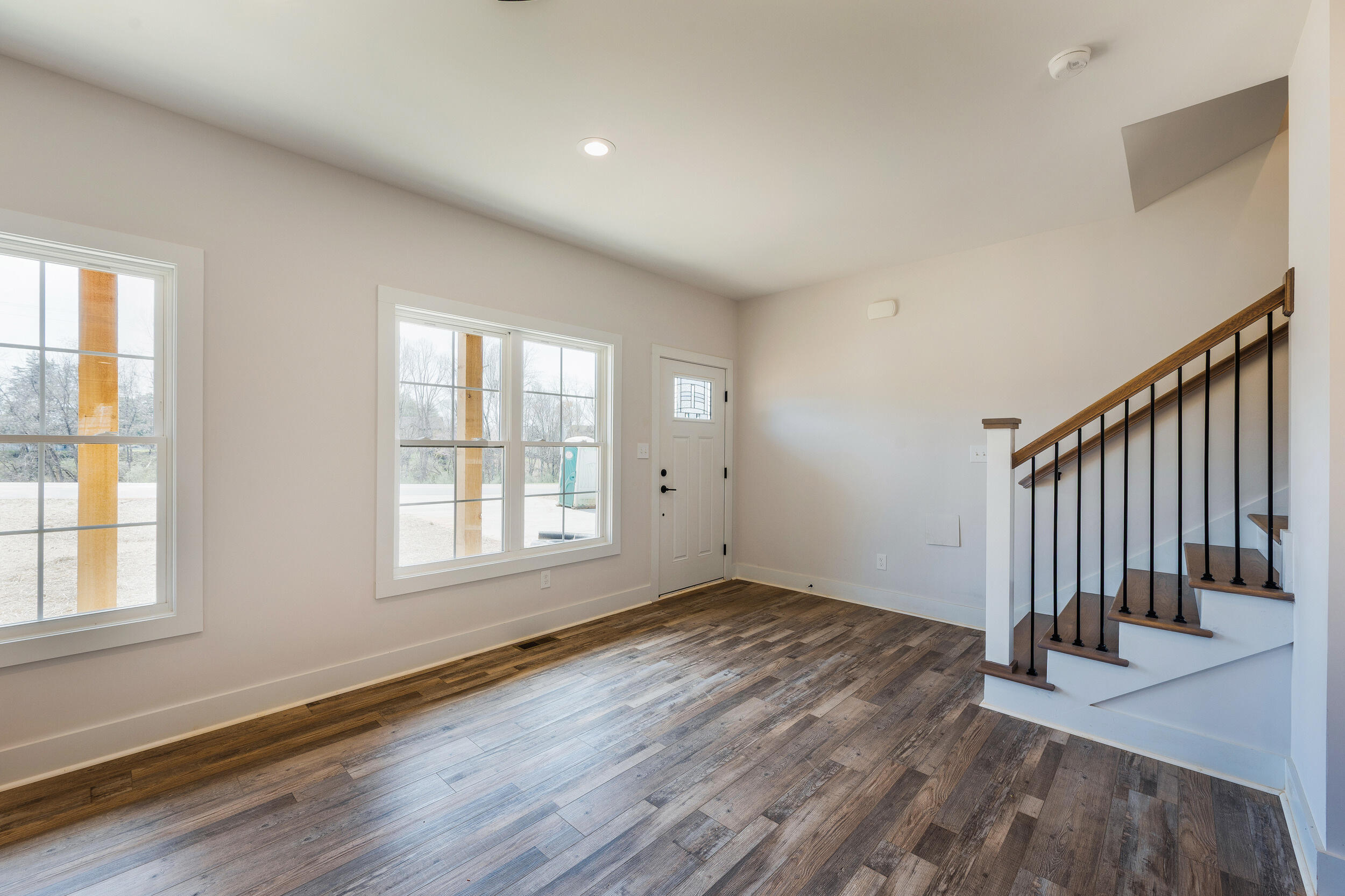 2199 Cottontown Road Forest, VA 24551 - Photo 5 of 35 an empty room with wooden floor and windows