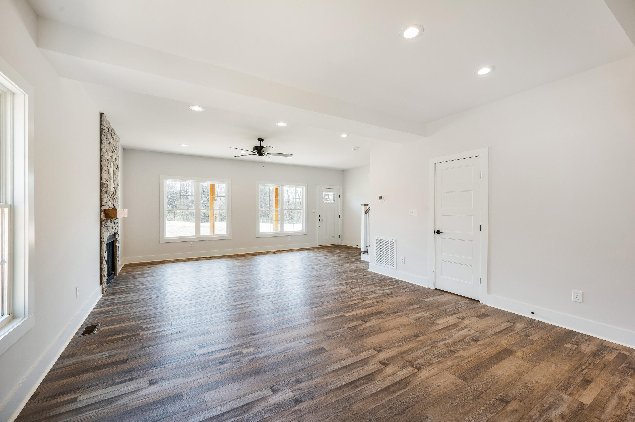 2199 Cottontown Road Forest, VA 24551 - Photo 6 of 35 a view of an empty room with wooden floor and a window