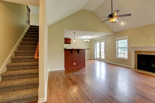 wooden floor in an empty room with a fireplace