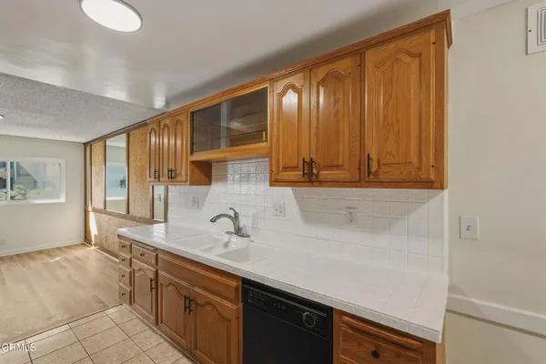 a kitchen with a sink and a window