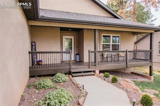 a view of front door with wooden floor