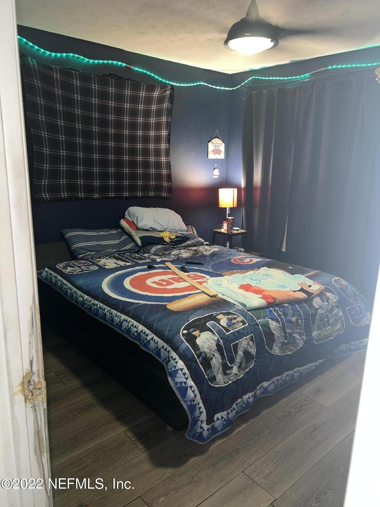120 Kelly Smith School Road Palatka, FL 32177 - Photo 11 of 17 a bed sitting in a bedroom next to a window