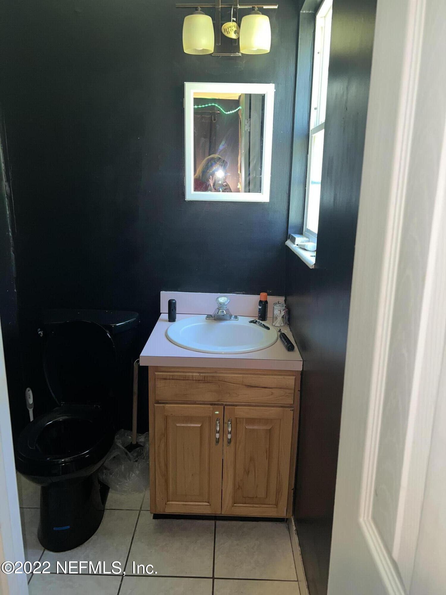 120 Kelly Smith School Road Palatka, FL 32177 - Photo 12 of 17 a bathroom with a sink and a mirror