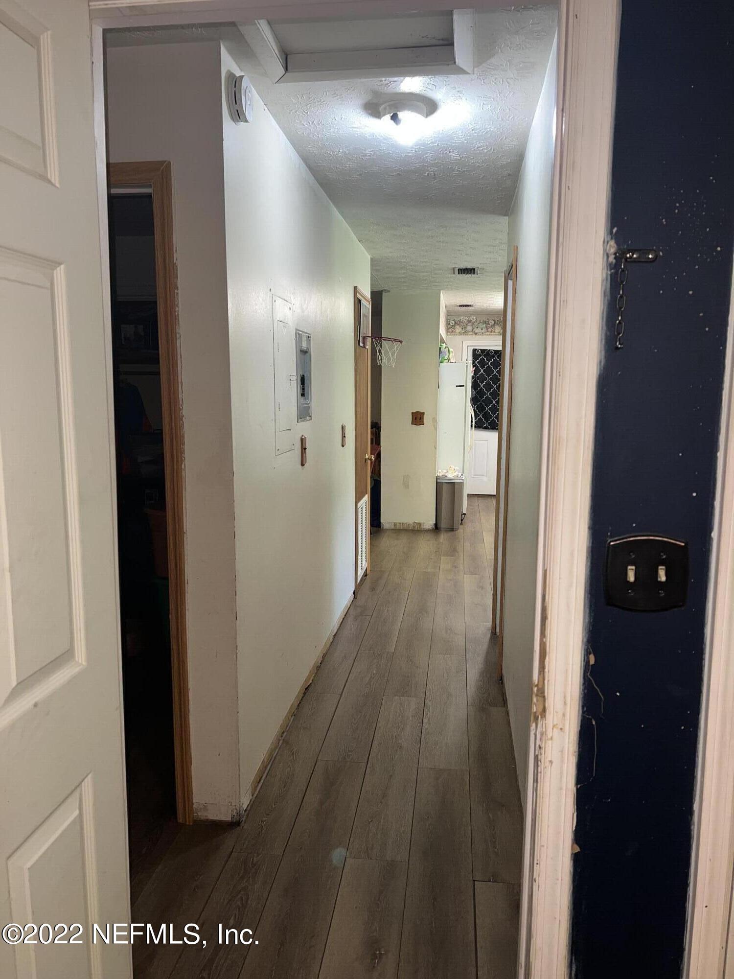 120 Kelly Smith School Road Palatka, FL 32177 - Photo 14 of 17 a view of hallway with wooden floor