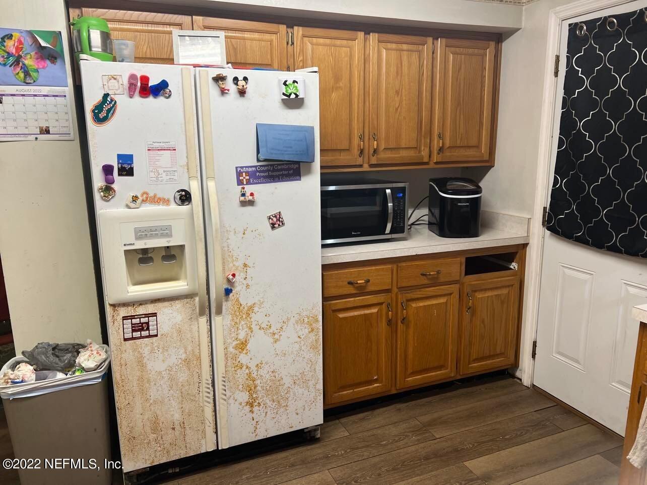 120 Kelly Smith School Road Palatka, FL 32177 - Photo 15 of 17 a white refrigerator freezer sitting inside of a kitchen