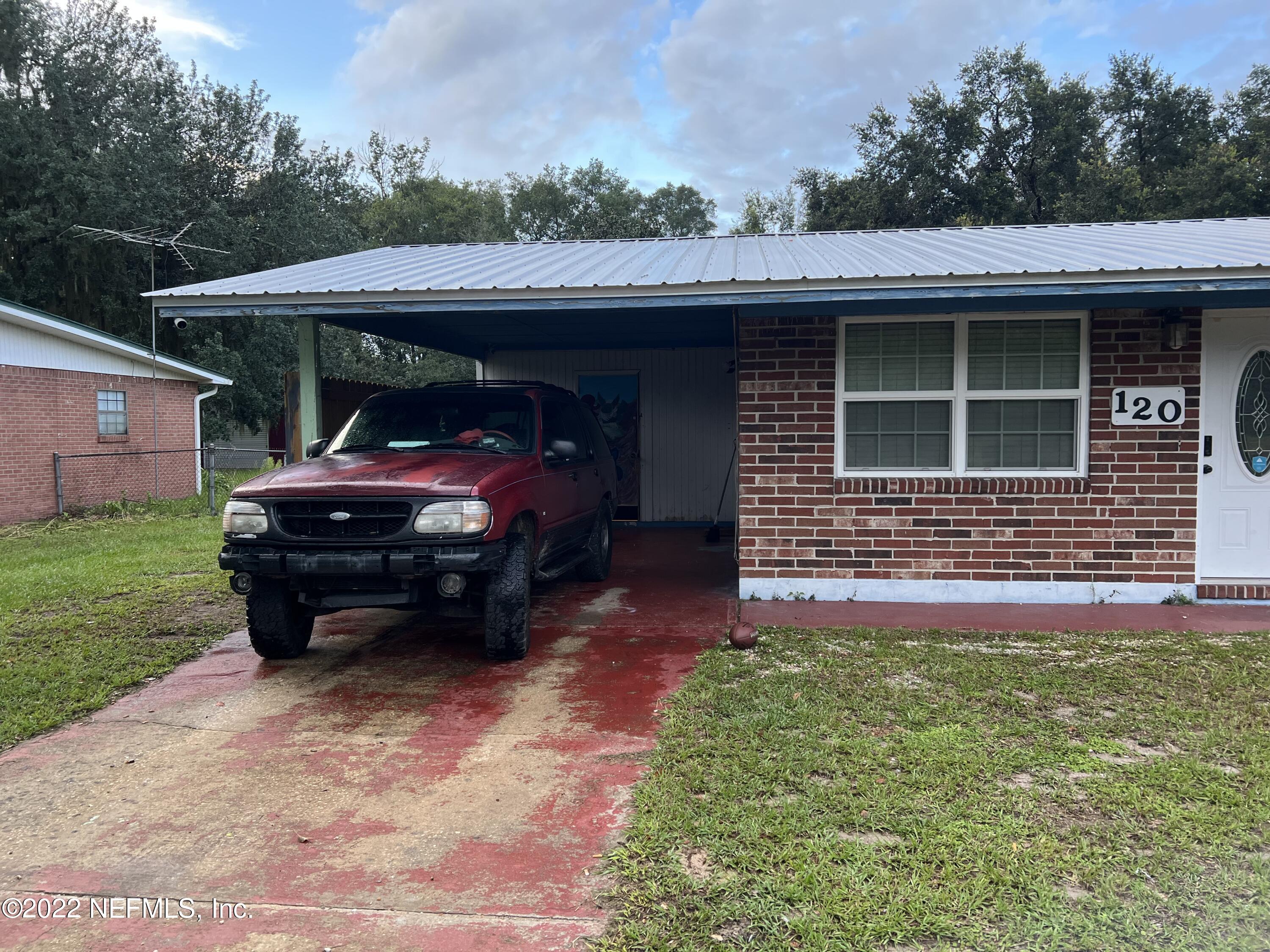 120 Kelly Smith School Road Palatka, FL 32177 - Photo 3 of 17 a front view of a house with garden