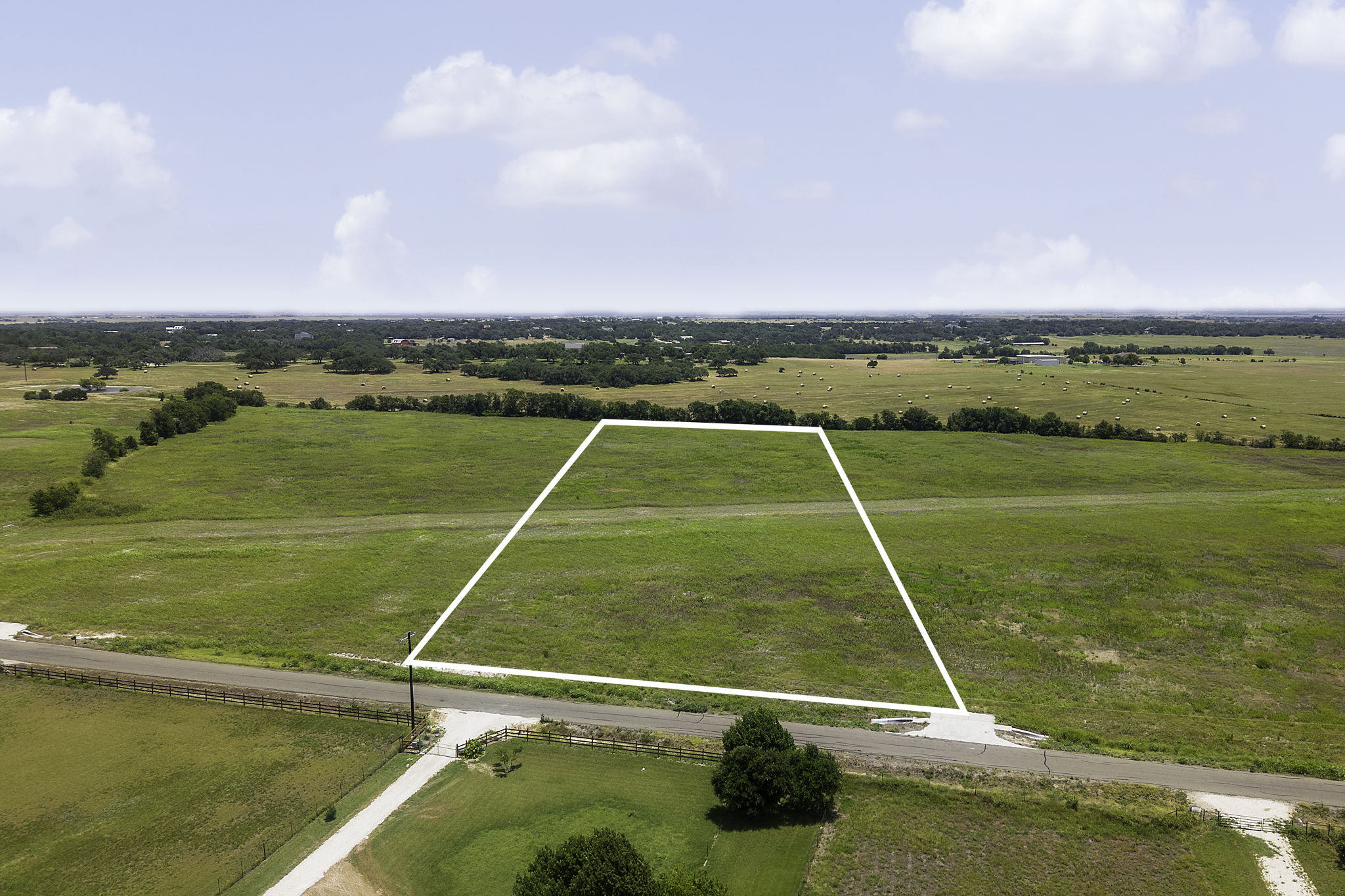 1250 County Road 153 Georgetown, TX 78626 - Photo 1 of 6 A pristine, expansive lot awaits your architectural vision amidst a serene pastoral landscape.