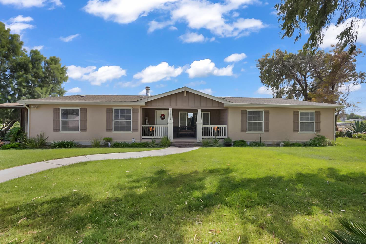 19814 West Grant Line Road Tracy, CA 95391 - Photo 1 of 57 a view of a house with a yard
