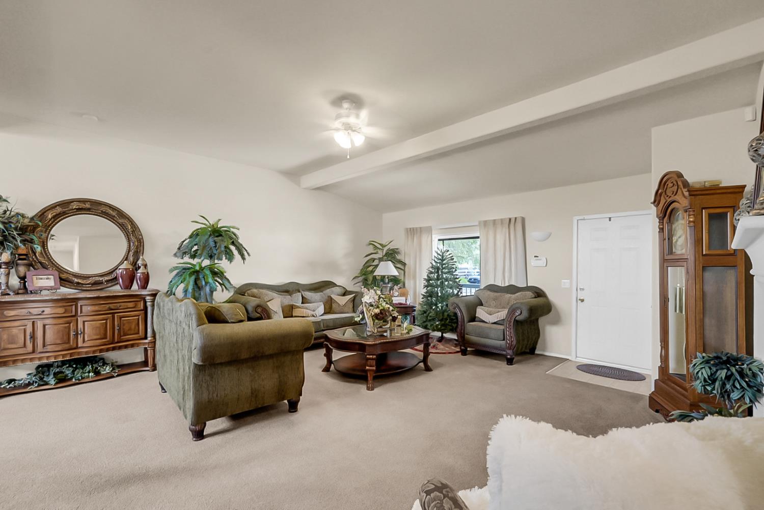 19814 West Grant Line Road Tracy, CA 95391 - Photo 2 of 57 a living room with furniture a couch and a chandelier